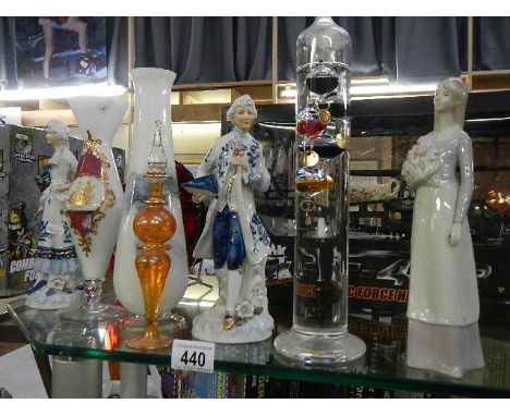 A mixed lot of ceramic figures and glass vases.