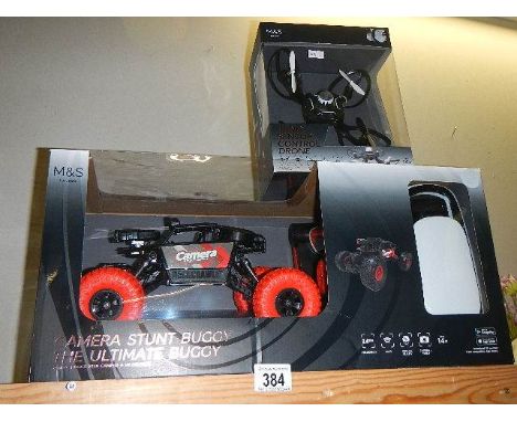A boxed M &amp; S Camera Stunt 'The Ultimate Buggy' and a hand sensor control done, both sealed.