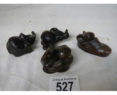 Four Japanese figures including netsuke.