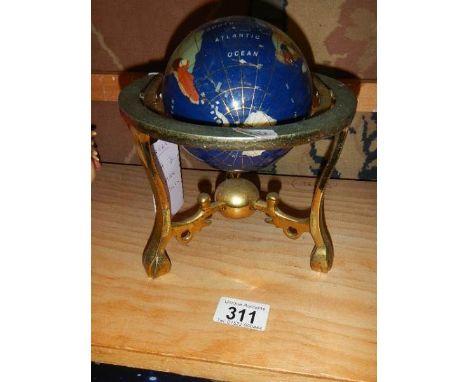 A jewelled globe on stand.