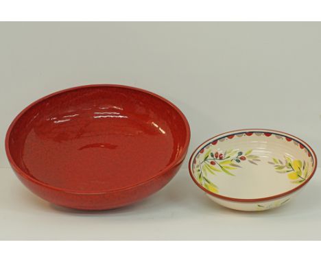 A large ceramic red fruit bowl diam. 50cm, H15cm together with a fruit bowl by M&S diam.34cm, modern. (2)Provenance: Chris Ph