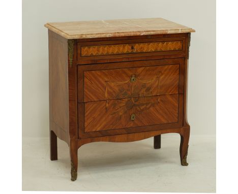 A French Transition style commode inlaid with Kingwood and fruitwoods, three drawers below a pink marble top, mounted with or