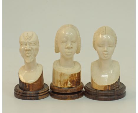 Three carved ivory African heads - 2 female, 1 male - all mounted on wooden bases, H18cm, H18cm, and H16cm, approx.weight: 25