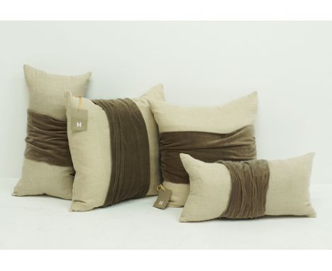A set of four linen and light brown velvet cushions with feather and down inners, measuring 54x54cm and 30x60cm. The labels a