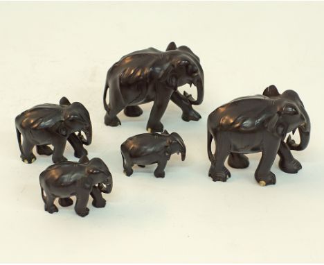 Five carved wooden elephants probably ebony, the largest H10cm, W12cm.(5)Provenance: From the Estate of Loukis & Lia Petrides