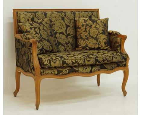 A Louis XV style two seater settee or love seat by Greek cabinetmaker Sarides, carved walnut upholstered in green and gold fa