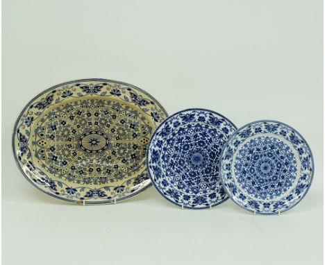 A group of three Indian Ornament ceramic dishes comprising an oval meat platter 42,5x33cm and two round plates d.23,5cm and d