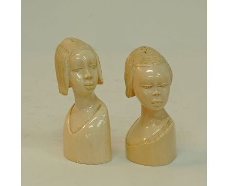 Two carved ivory African female heads, H15cm and H16cm, approx. weight: 1206g. Mid 20th century. (2)Provenance: From the Esta