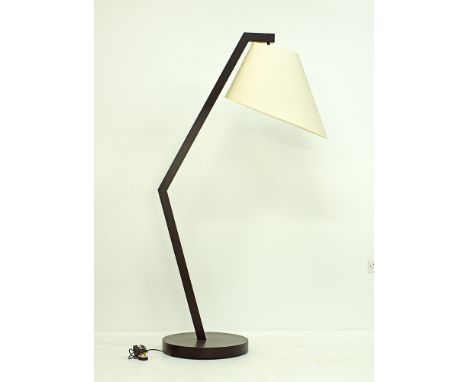 A 'Clint' floor lamp by Natuzzi, on a black stained wood shaped stand with a white cylindrical shade, H183cm, modern.Provenan