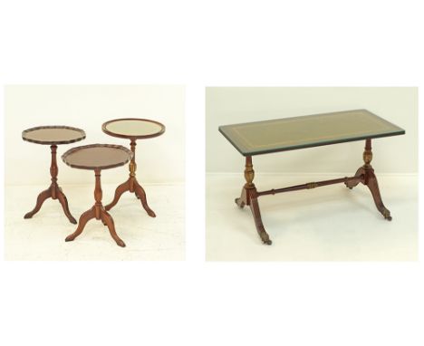 A group of four mahogany side tables, three on tripod pedestals, one round with leather inset top and glass, two with gadroon
