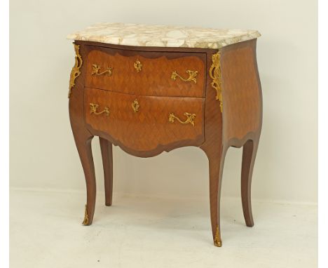 A French Louis XV style bombe commode, two drawers below a French marble top, parqueter veneered in kingwood, with ormolu mou