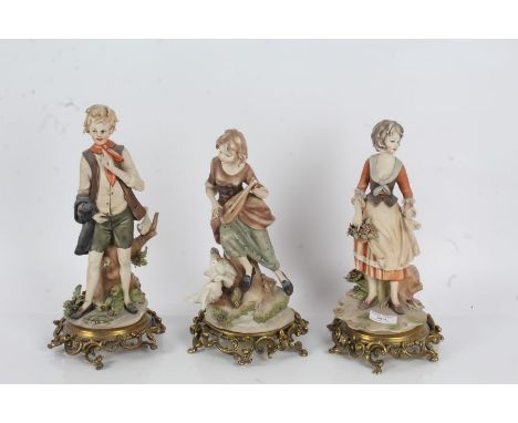 Three Capodimonte figures, to include a girl playing music for geese, a girl with basket of apples and a boy with a dove, all