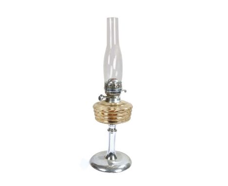 English Made oil lamp, the clear glass chimney above a reeded brown glass reservoir, raised on a waisted chrome stem and foot
