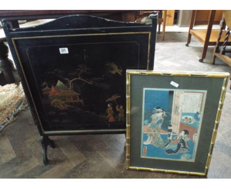 A Chinese black lacquered fire screen and a gilt framed print 