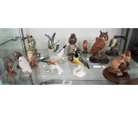 A collection of bird figurines to include Royal Doulton, Poole Pottery, Country Artists and Hummel 