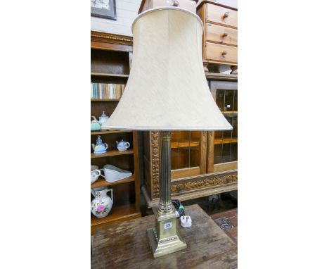 A brass Corinthian column table lamp with shade 