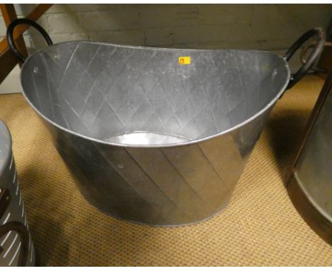 A large oval galvanized two handled planter  