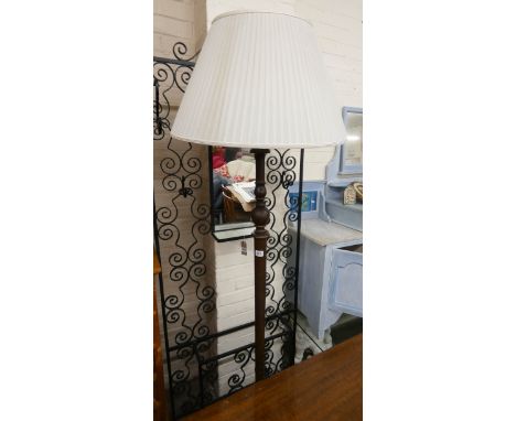 An oak standard lamp with off white shade 