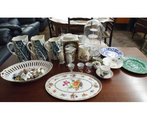 A quantity of thimbles in display cabinet, a set of three blue and white jugs, tea caddy and assorted china   