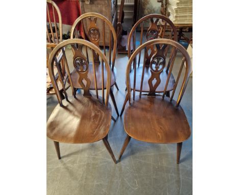 Quartet of Ercol Fleur De Lys Motif Stick Back Dining Chairs