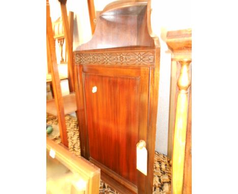 An early 10th C mahogany corner cabinet with blind fret-work panel and shelf below 80cm high x 42.5cm wide x 22cm deep