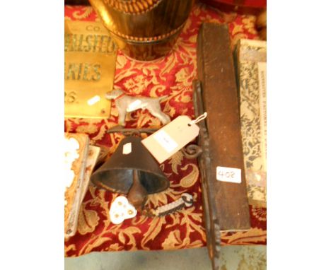 An outside bell mounted on a board and a vintage level, boxed 
