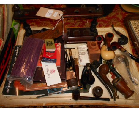A selection of pipes and a pipe rack to include meerschaum, Parker, Dunhill silver collared, etc