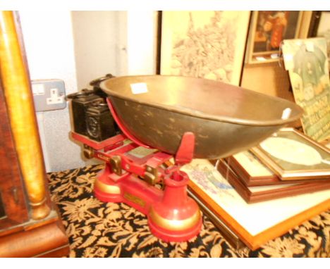A set of vintage 'Thirsk Equipment Co Ltd' painted iron and brass 14lb scales with weights