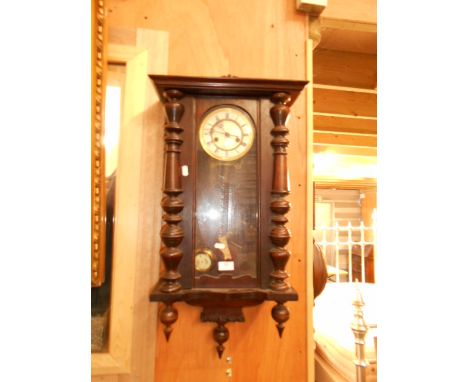 A Victorian mahogany regulator wall clock the enamel dial decorated with Fleur-de-lyse and Roman numerals flanked by a pair o