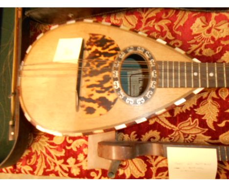 A vintage Italian 'Il Globo' mandolin with mother of pearl inlay and faux tortoiseshell decoration, in case for restoration
