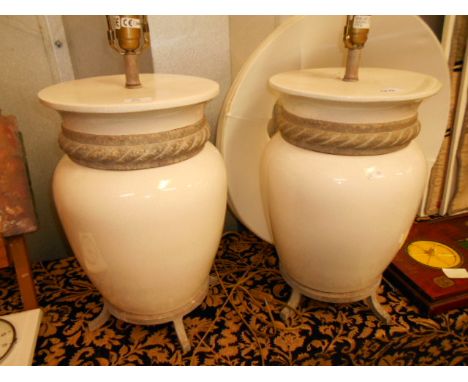 A large pair of cream crackle glaze pottery lamps with stoneware rope-twist collars resting on footed bases by Fine Art Lamps