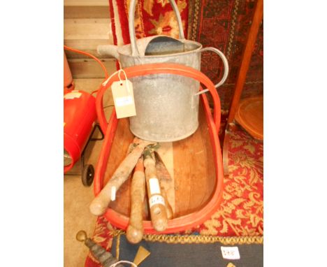A trug, a watering can and a selection of vintage gardening tools 