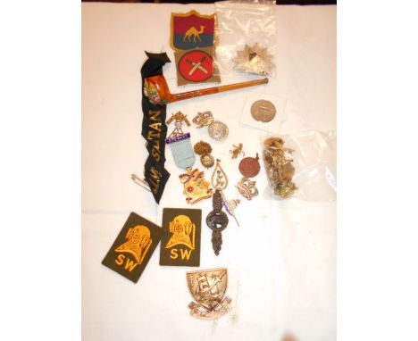 A selection of assorted militaria to include a pipe etc
