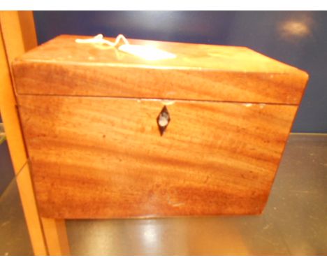 A mahogany tea caddy having internal compartments with lids