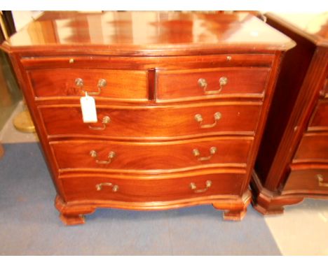 A late-20th C mahogany chest the serpentine top with canted corners over brush slides and two short over three long graduatin