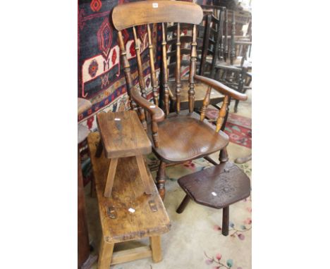 A 19th Century ladder back chair, with solid seat and turned legs joined by stretchers, remains of paint, an elm and beech sp