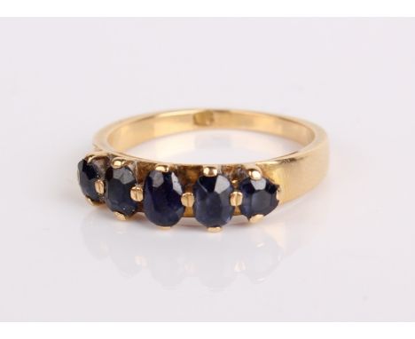 An 18ct gold and five stone sapphire ring, 4.8g in total ring size R approx.