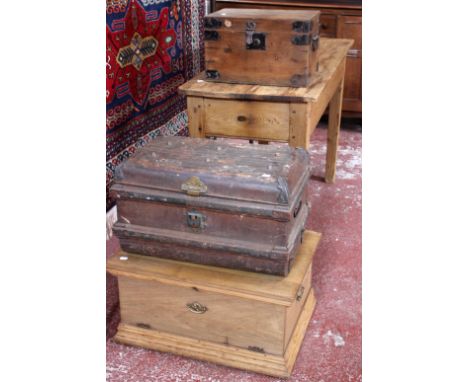 A pine table, metalware trunk and two further pine boxes 