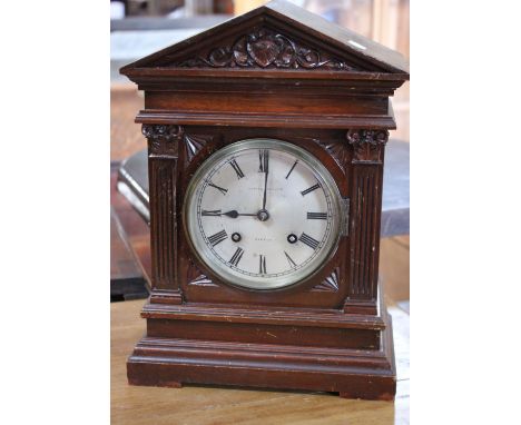 An early 20th Century mahogany bracket clock with silvered Roman Numeral dial, Depree Young Ltd, Exeter 36cm high 