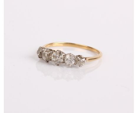 A gold and diamond five stone ring, 2.3g in total Ring size R approx.