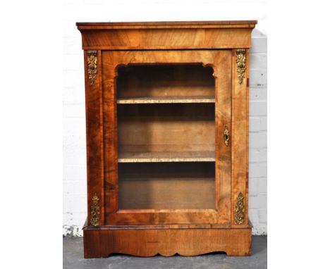 Victorian walnut vitrine, rectangular top, plain frieze, glazed door enclosing two shelves, flanked by gilt metal corbels, sh