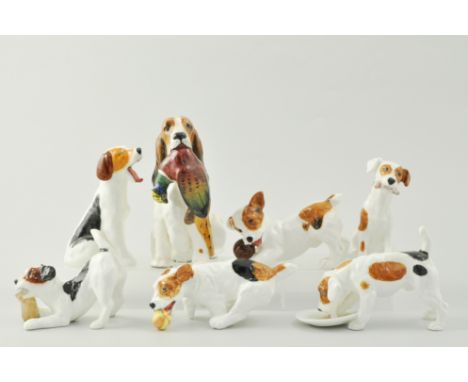 Royal Doulton model of a Retriever HN1028, 15cm and six Doulton models of puppies, (7).