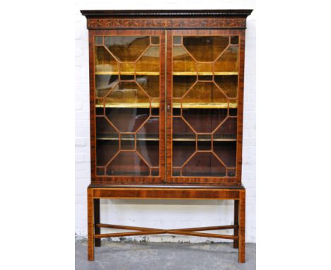 Georgian mahogany display cabinet, dentil and cavetto moulded cornice, inlaid marquetry frieze, glazed doors enclosing two fi