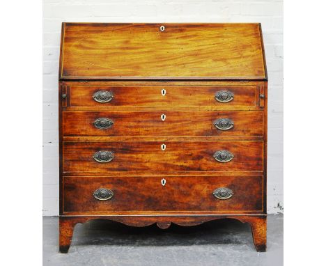George III mahogany slope and fall front bureau, well fitted interior of drawers and pigeon holes, centred by a cupboard, the