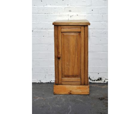 Pine pot cupboard, top with moulded edge, panel door enclosing a shelf, plinth base, width 34cm, depth 33cm, height 69cm.