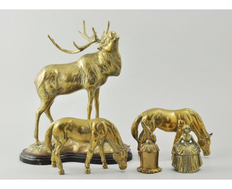 Brass model of a stag, horse models, horse brasses, leather straps.
