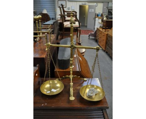 Set of brass pedestal scales, by Doyle & Son, London, approximate height 59cm.
