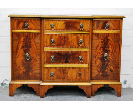 Reproduction mahogany small sideboard, breakfront top with broad crossbanding a moulded edge, central bank of four graduating