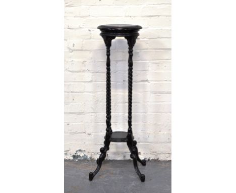 Stained beechwood plant stand, circular top with moulded edge, barley twist columns, joined by a shelf, scrolled legs, height