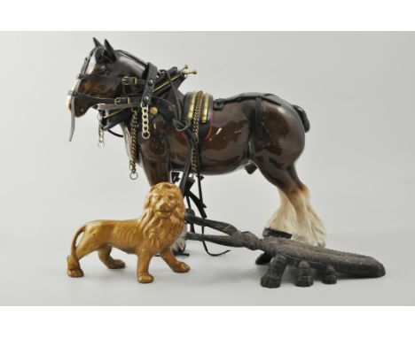 Melba pottery shire horse model, other horses, metal lion and a cast iron beetle book jack.